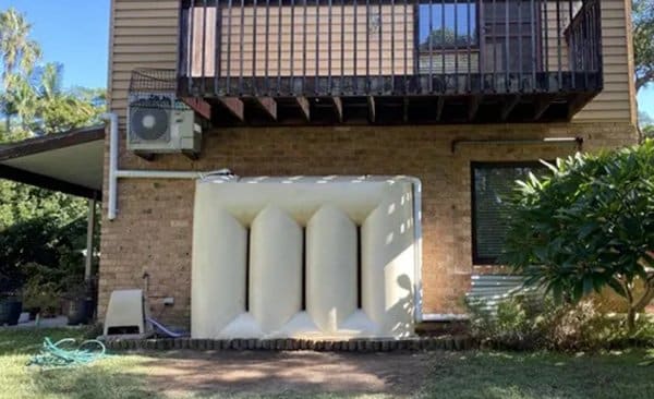 Rainwater tank outside home