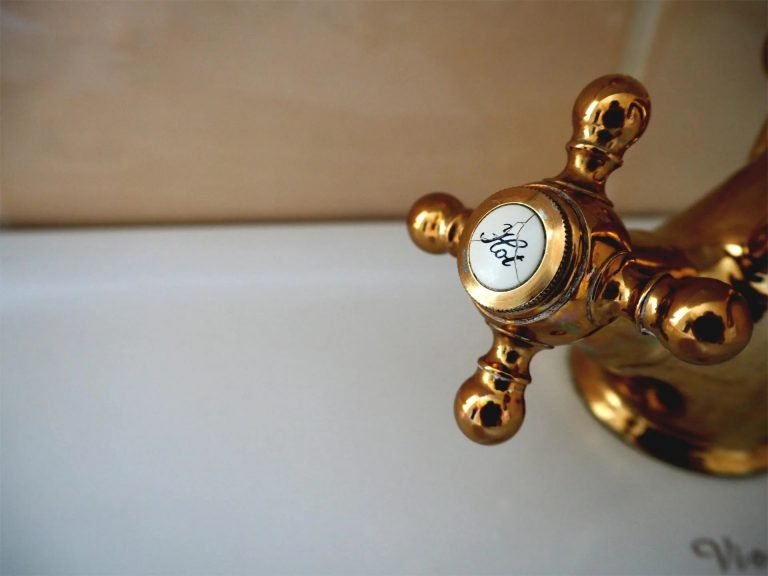 cracked brass hot water tap