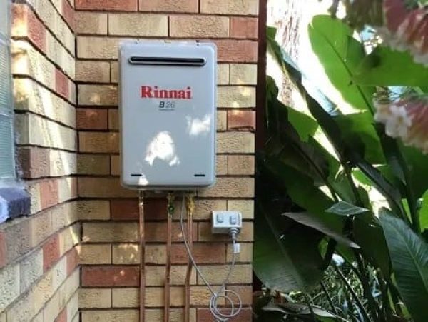 Gas Instantaneous unit against brick wall